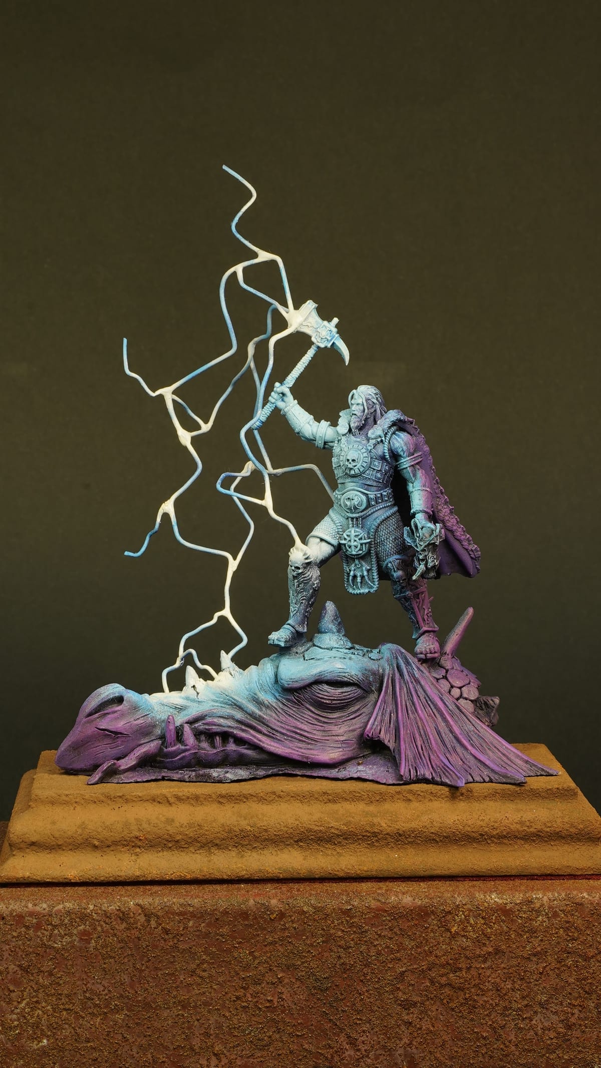 The lightning figure on its wooden plinth
