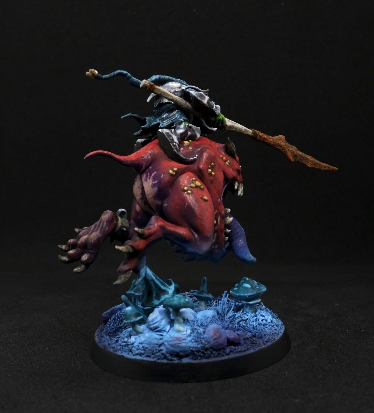 The squig rider against a dark background